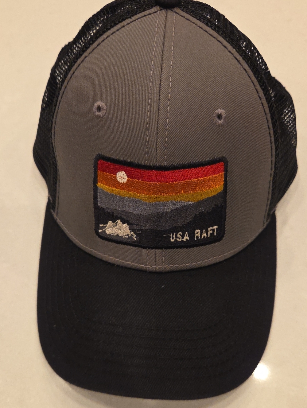 Blue 84 Gray and Black Trucker Hat with Sunset Patch